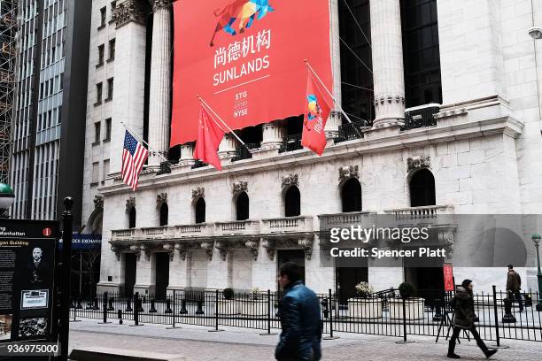 The Sunlands Online Education banner and the Chinese flag hang in front of the New York Stock Exchange during the Beijing-based firms IPO on March...