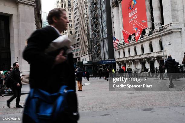 The Sunlands Online Education banner and the Chinese flag hang in front of the New York Stock Exchange during the Beijing-based firms IPO on March...