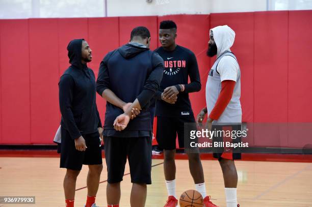 Markel Brown Clint Cappella James Harden and Chris Paul of the Houston Rockets talk during a Houston Rockets practice at Toyota Center in Houston,...