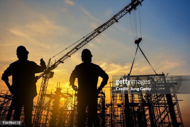 silhouette construction worker concrete pouring during commercial concreting floors of building in construction site and civil engineer or construction engineer inspec work - contracting stock pictures, royalty-free photos & images