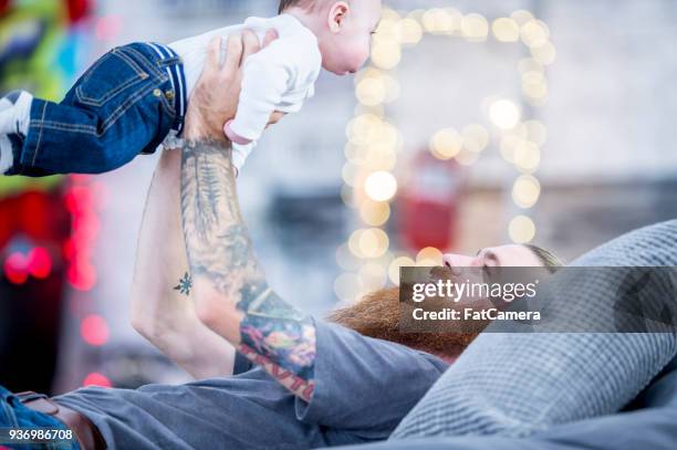 Guy Rocking A Baby 613 Punk Rock Baby Stock Photos, High-Res Pictures, and Images - Getty ...