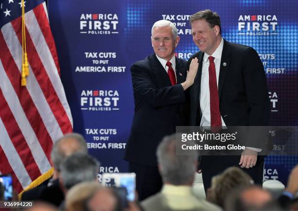 Vice President Mike Pence, left, stands with New Hampshire Governor Christopher Sununu after Sununu introduced him as the guest speaker at an event...