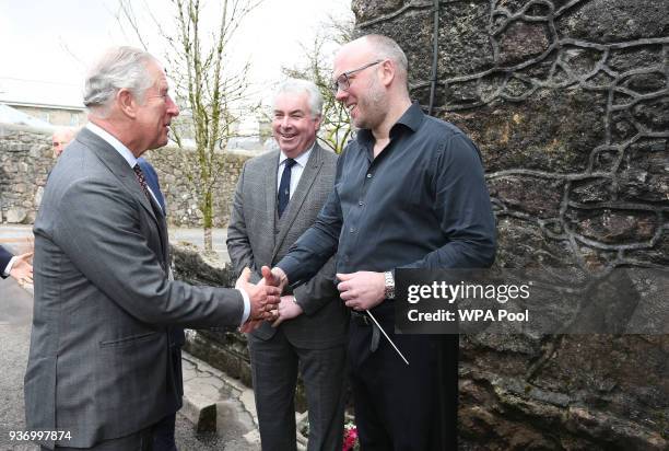 Prince Charles, Prince of Wales meets Musical Director Adam Green as he visits HM Prison Dartmoor on March 23, 2017 in London, United Kingdom.