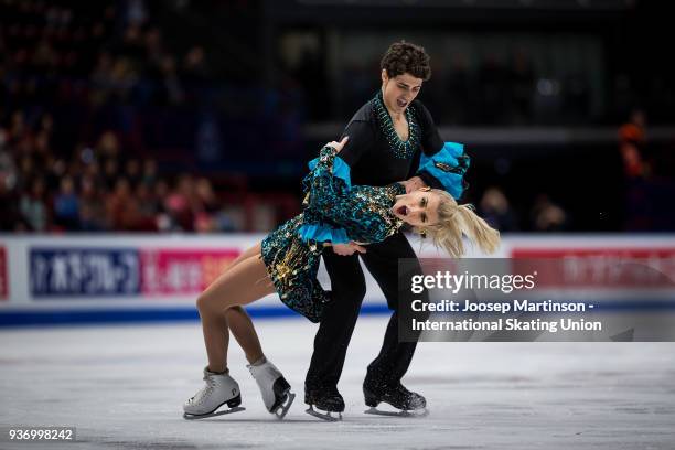 Piper Gilles and Paul Poirier of Canada compete in the Pairs Free Skating during day two of the World Figure Skating Championships at Mediolanum...