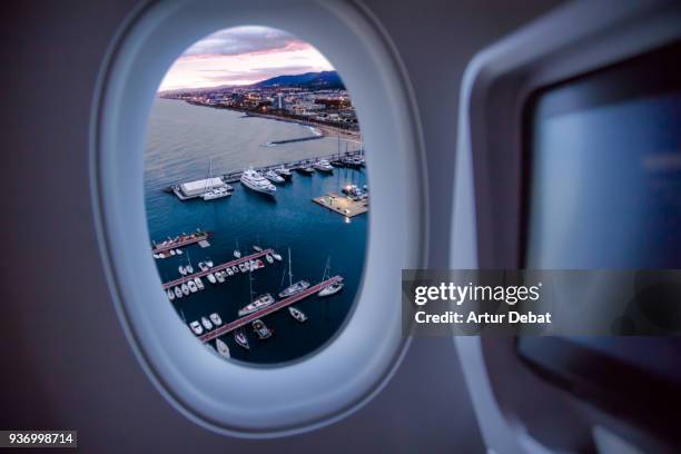 picture taken from airplane window traveling around the world from the airplane seat view. - plane seat stock pictures, royalty-free photos & images