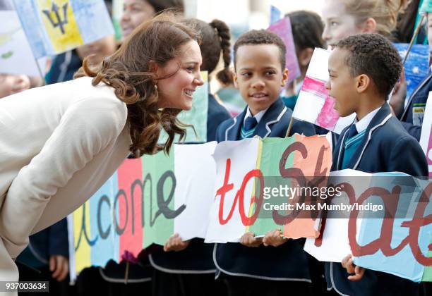 Catherine, Duchess of Cambridge talks with schoolchildren as she attends a SportsAid event at the Copper Box Arena in Queen Elizabeth Olympic Park on...