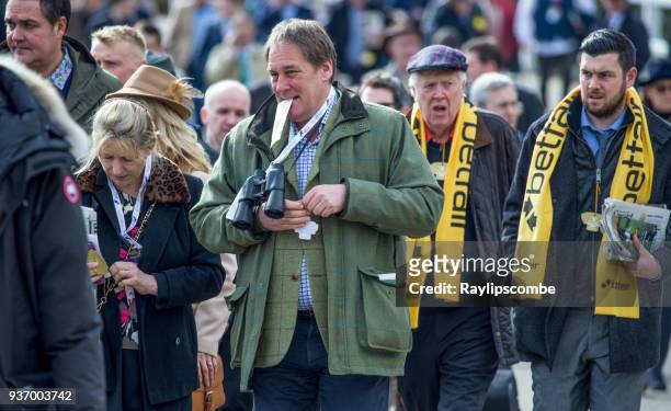 crowds of people on their way to the world famous cheltenham festival racecourse - horse racing crowd stock pictures, royalty-free photos & images
