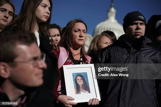 Lori Alhadeff and her husband Ilan Alhadeff hold a picture of their daughter Alyssa Alhadeff, a Marjory Stoneman Douglas High School shooting victim,...