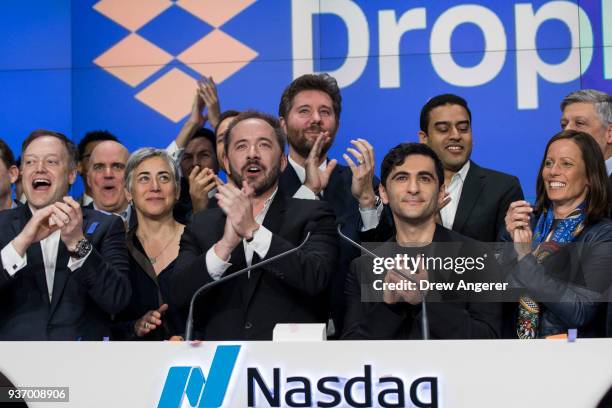 Dropbox CEO Drew Houston and Dropbox co-founder Arash Ferdowsi celebrate the launch of Dropbox's initial public offering as they ring the opening...