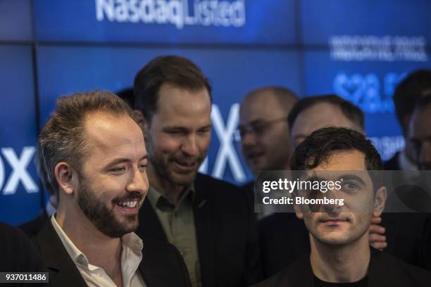 Drew Houston, chief executive officer and co-founder of Dropbox Inc., left, and Arash Ferdowsi, co-founder of Dropbox Inc., react during the...