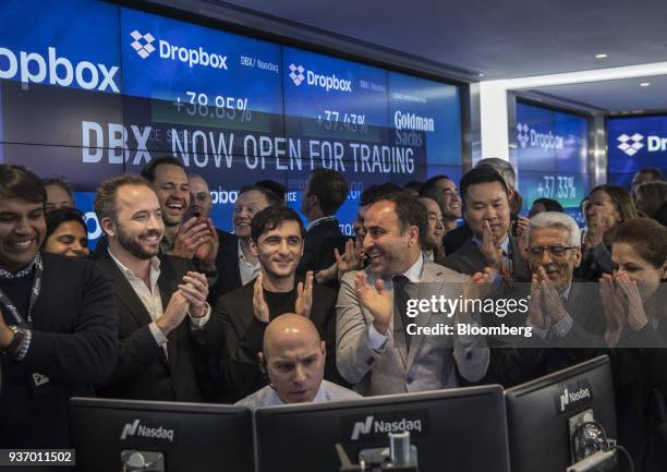 Drew Houston, chief executive officer and co-founder of Dropbox Inc., second left, and Arash Ferdowsi, co-founder of Dropbox Inc., third left,...