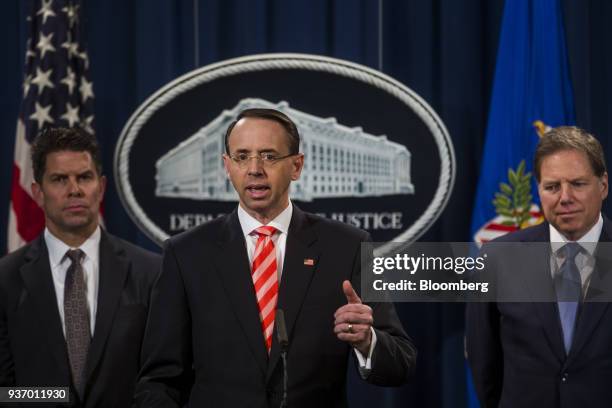 Rod Rosenstein, deputy attorney general, center, speaks during a news conference on cyber law enforcement at the Department of Justice in Washington,...