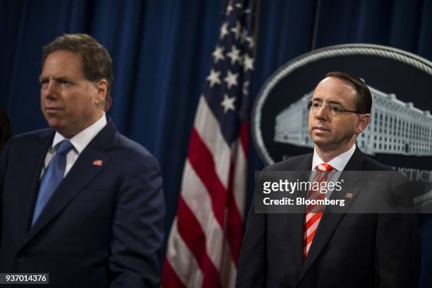 Geoffrey Berman, U.S. Attorney for the Southern District of New York, left, and Rod Rosenstein, deputy attorney general, listen during a news...