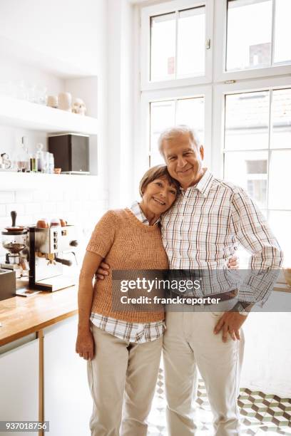 senior adult standing in the kitchen