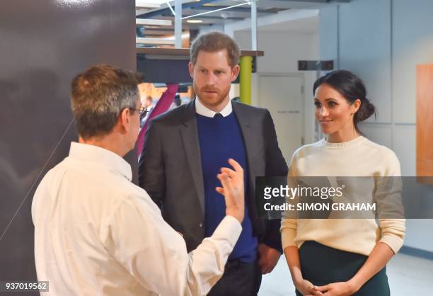 Britain's Prince Harry and Prince Harry's fiancee, US actress Meghan Markle speak with Steve Orr , co-founder and Director of Connect at Catalyst...