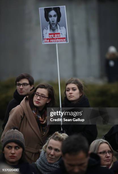 Young woman holds a sign showing Princess Leia of Star Wars among people protesting against a new government measure to further restrict abortions in...
