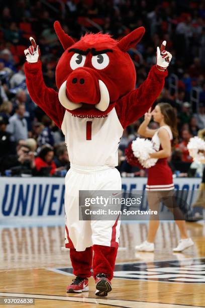 The Arkansas mascot entertains during a timeout during the NCAA Division I Men's Championship First Round basketball game between the Arkansas...