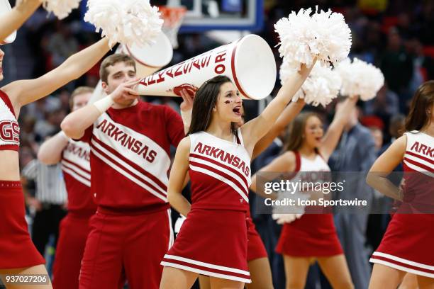 The Arkansas dance team and cheerleaders entertain during the NCAA Division I Men's Championship First Round basketball game between the Arkansas...