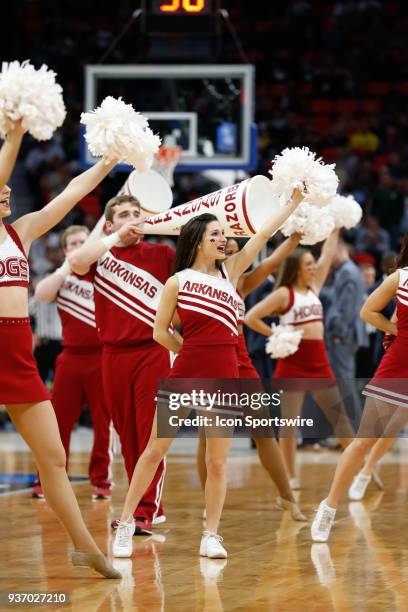 The Arkansas dance team and cheerleaders entertain during the NCAA Division I Men's Championship First Round basketball game between the Arkansas...