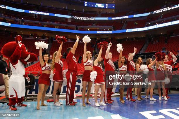 The Arkansas cheerleaders and mascot wave to the crowd at the conclusion of the NCAA Division I Men's Championship First Round basketball game...