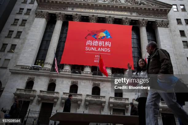 Sunlands Online Education Group signage hangs on display outside the New York Stock Exchange during the company's initial public offering in New...