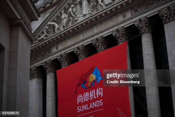Sunlands Online Education Group signage hangs on display outside the New York Stock Exchange during the company's initial public offering in New...