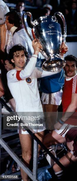Dennis Mortimer of Aston Villa celebrates with the trophy after victory in the Aston Villa v Bayern Munich European Cup Final played at the De Kuip...