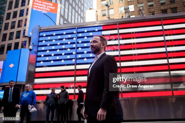 Dropbox CEO Drew Houston walks through Times Square after the launch of Dropbox's initial public offering at Nasdaq MarketSite, March 23, 2018 in New...