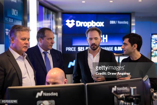 Dropbox CEO Drew Houston and Dropbox co-founder Arash Ferdowsi monitor computer screens as trading starts on Dropbox's initial public offering at...