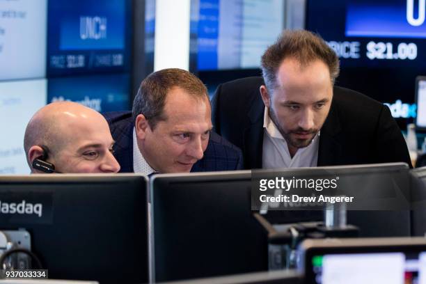 Dropbox CEO Drew Houston monitors a computer screen as trading starts on Dropbox's initial public offering at Nasdaq MarketSite, March 23, 2018 in...