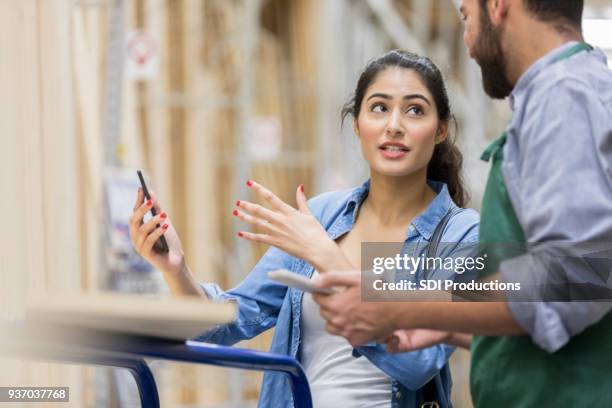 hardware store customer explains idea to sales associate - store manager stock pictures, royalty-free photos & images
