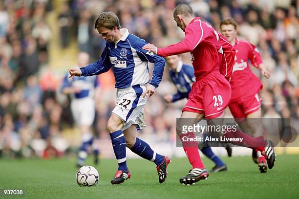 Tobias Linderoth of Everton takes the ball past Stephen Wright of Liverpool during the FA Barclaycard Premiership match played at Anfield, in...