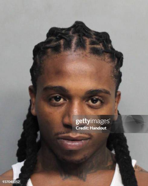 In this handout photo provided by the Miami-Dade Police Department, singer Jacquees is seen in a police booking photo after his arrest on charges of...