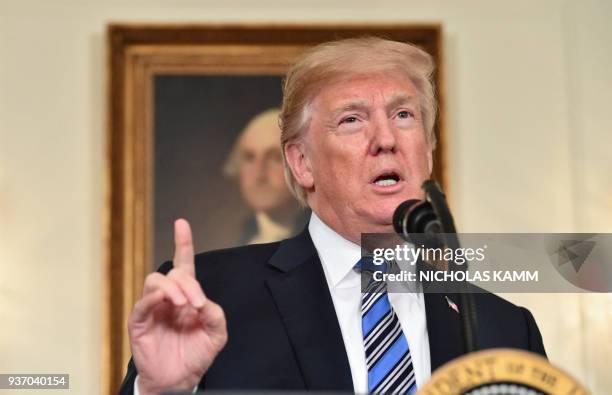 President Donald Trump speaks about the spending bill during a press conference in the Diplomatic Reception Room at the White House on March 23, 2018.