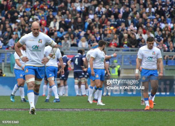 The captain of the Italian national team Sergio Parisse and Matteo Minozzi react during the Six Nations Rugby match Italy vs Scotland at the Olimpico...