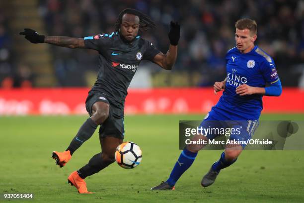 Marc Albrighton of Leicester City in action with Victor Moses of Chelsea during the Emirates FA Cup Quarter Final match between Leicester City and...
