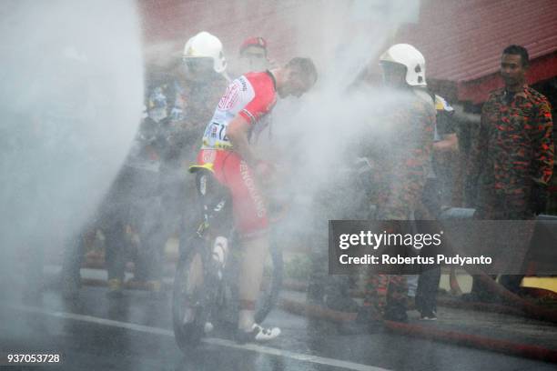 Andris Vosekalns of Hengxiang Cycling Team China is sprayed during Stage 6 of the Le Tour de Langkawi 2018, Tapah-Tanjung Malim 108.5 km on March 23,...