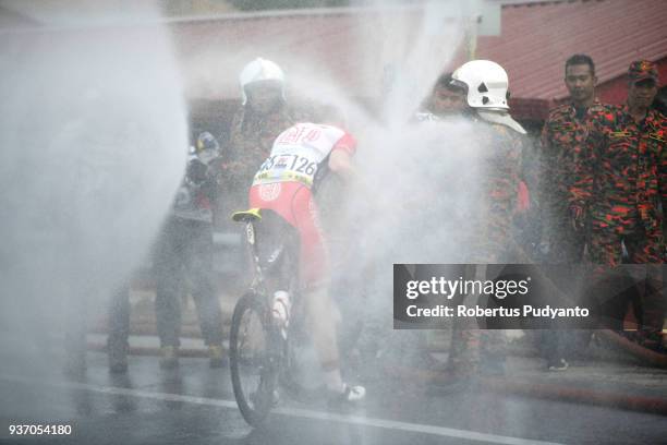 Andris Vosekalns of Hengxiang Cycling Team China is sprayed during Stage 6 of the Le Tour de Langkawi 2018, Tapah-Tanjung Malim 108.5 km on March 23,...