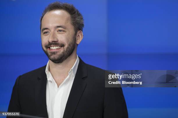 Drew Houston, chief executive officer and co-founder of Dropbox Inc., smiles during the company's initial public offering at the Nasdaq MarketSite in...