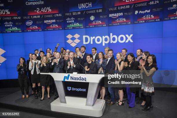 Drew Houston, chief executive officer and co-founder of Dropbox Inc., center left, and Arash Ferdowsi, co-founder of Dropbox Inc., center right,...