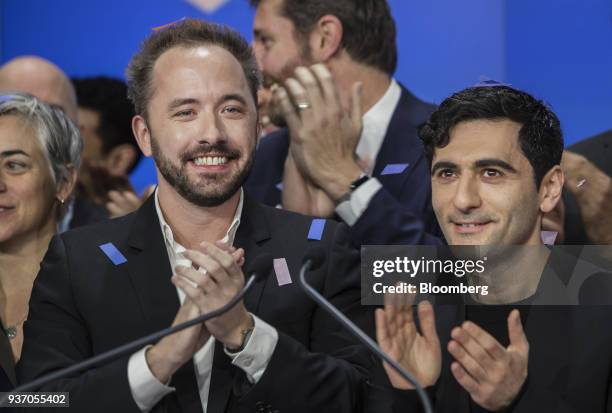 Drew Houston, chief executive officer and co-founder of Dropbox Inc., left, and Arash Ferdowsi, co-founder of Dropbox Inc., applaud during the...