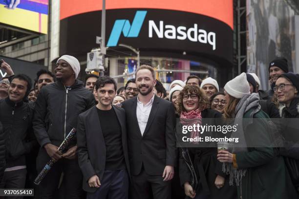 Drew Houston, chief executive officer and co-founder of Dropbox Inc., center right, and Arash Ferdowsi, co-founder of Dropbox Inc., center left,...