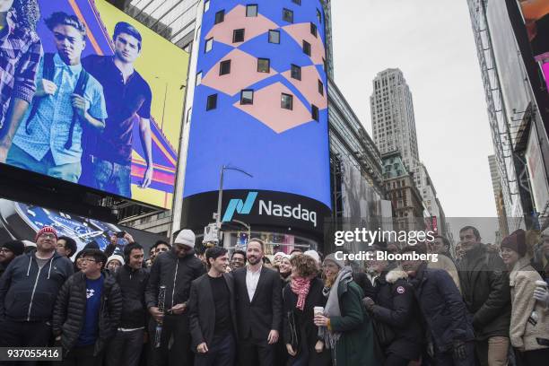 Drew Houston, chief executive officer and co-founder of Dropbox Inc., center right, and Arash Ferdowsi, co-founder of Dropbox Inc., center left,...