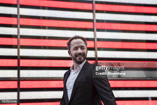 Drew Houston, chief executive officer and co-founder of Dropbox Inc., smiles outside the Nasdaq MarketSite during the company's initial public...