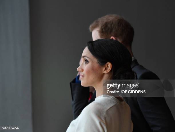 Britain's Prince Harry and Prince Harry's fiancee, US actress Meghan Markle during a visit to the iconic tourist attraction, Titanic Belfast, in...