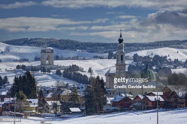 asiago church and first world war memorial monument during winter - asiago italy stock pictures, royalty-free photos & images