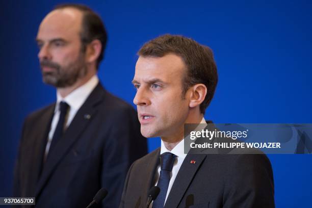 French President Emmanuel Macron delivers a speech at the Interior Minister in Paris attended by Prime Minister Edouard Philippe after a hostage...