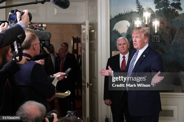 President Donald Trump speaks to the press about the $1.3 trillion spending bill passed by Congress early Friday, with Vice President Mike Pence , in...