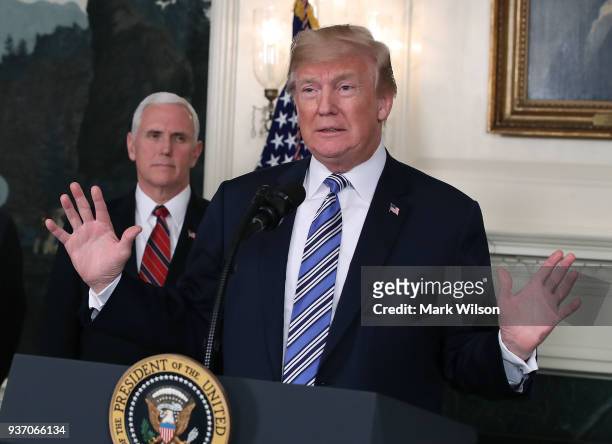 President Donald Trump speaks to the press about the $1.3 trillion spending bill passed by Congress early Friday, with Vice President Mike Pence , in...