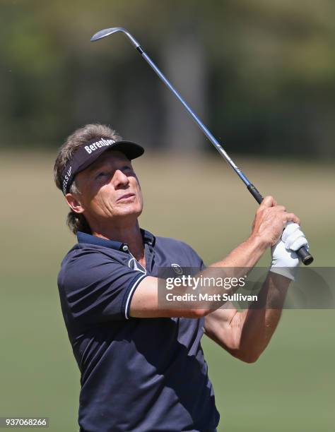 Bernhard Langer of Germany watches his second shot on the first hole during the first round of the Rapiscan Systems Classic at Fallen Oak Golf Course...